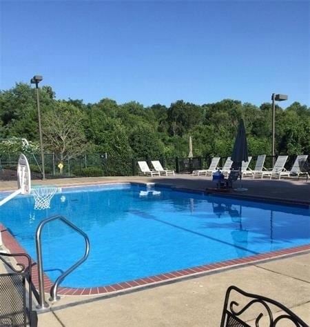 1500 Zenith Ct, Upper St Clair, PA 15241 - community pool featuring a patio area and a forest view
