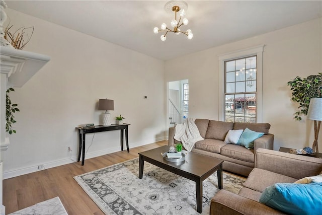 516 Division Ave, Bellevue, PA 15202 - living area with wood finished floors and a chandelier