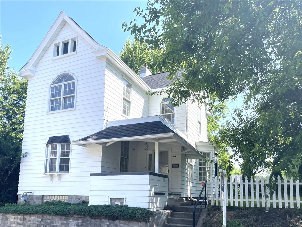 516 Division Ave, Bellevue, PA 15202 - view of front of house with a porch, a shingled roof, and a chimney