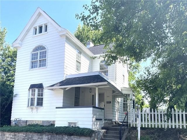 516 Division Ave, Bellevue, PA 15202 - view of front of house with a porch, a shingled roof, and a chimney