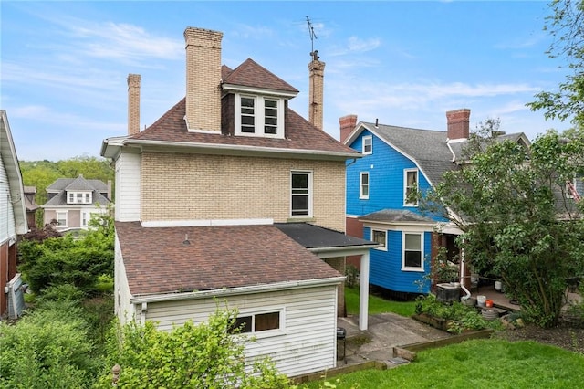 97 N Euclid Ave, Bellevue, PA 15202 - rear view of house with a chimney, roof with shingles, and a patio