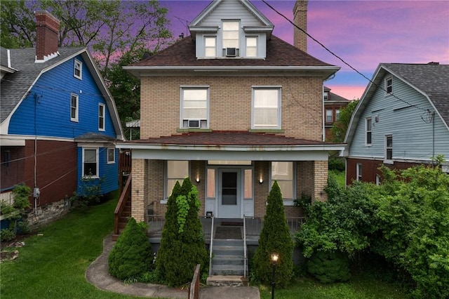 97 N Euclid Ave, Bellevue, PA 15202 - traditional style home with brick siding, a porch, a yard, and a chimney