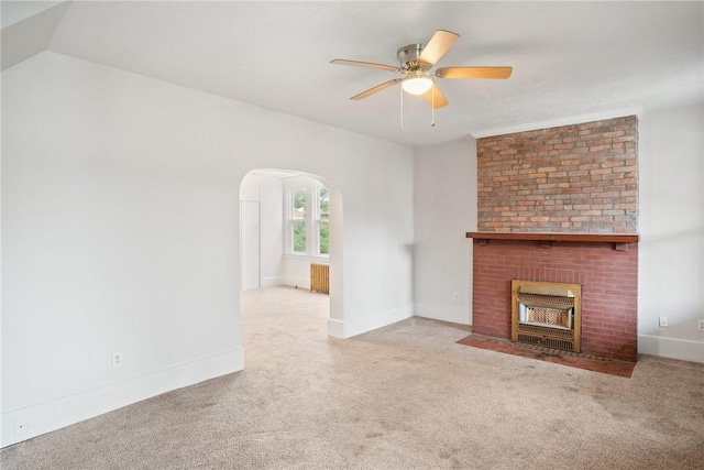 97 N Euclid Ave, Bellevue, PA 15202 - unfurnished living room with radiator, carpet floors, a ceiling fan, and a fireplace