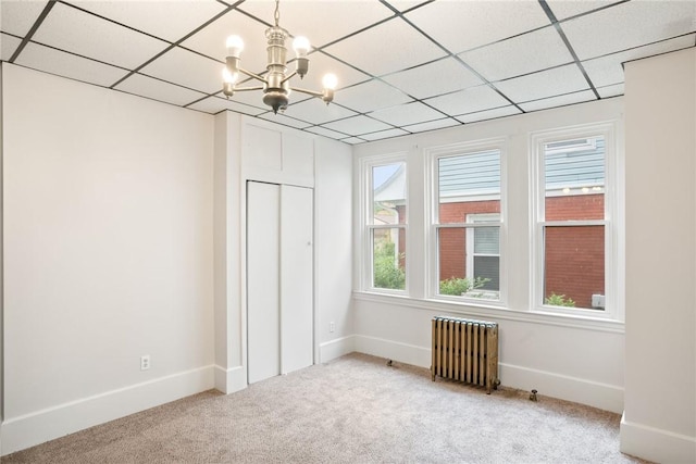 97 N Euclid Ave, Bellevue, PA 15202 - carpeted spare room featuring radiator, a drop ceiling, and a chandelier