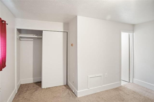 97 N Euclid Ave, Bellevue, PA 15202 - unfurnished bedroom with light colored carpet, a closet, and a textured ceiling
