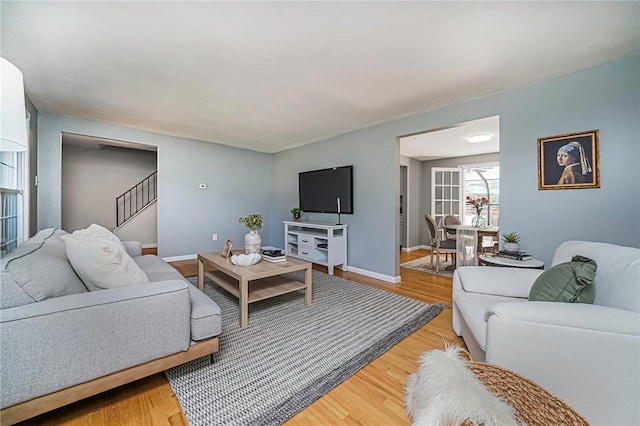 150 Dover Dr, Moon/Crescent Twp, PA 15108 - living room featuring stairs and light wood-style flooring