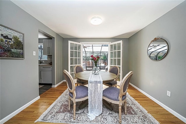 150 Dover Dr, Moon/Crescent Twp, PA 15108 - dining space featuring wood finished floors and baseboards
