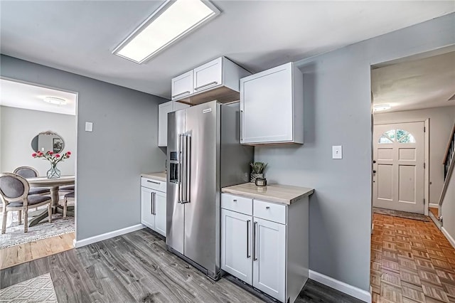 150 Dover Dr, Moon/Crescent Twp, PA 15108 - kitchen with high end fridge, light countertops, wood finished floors, and white cabinets