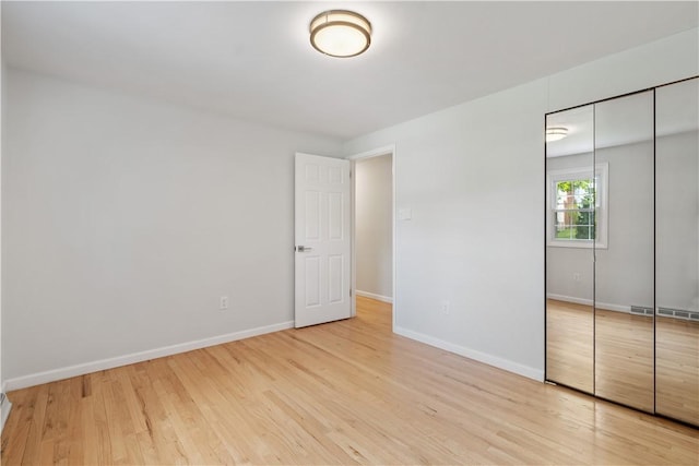 150 Dover Dr, Moon/Crescent Twp, PA 15108 - unfurnished bedroom featuring a closet and wood finished floors