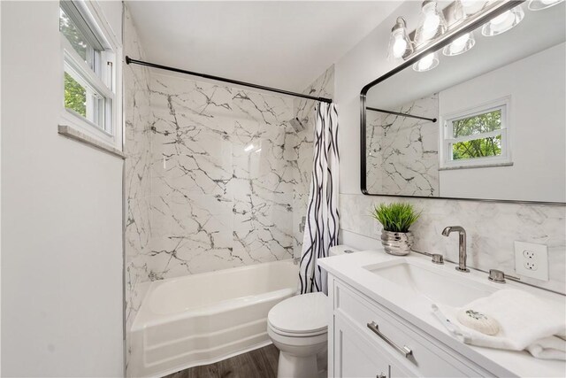 150 Dover Dr, Moon/Crescent Twp, PA 15108 - full bathroom with vanity, shower / tub combo, wood finished floors, and tasteful backsplash