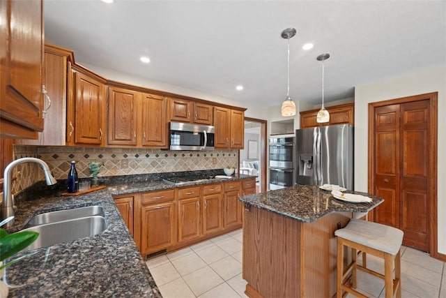 105 Averys Way, Cranberry Twp, PA 16066 - kitchen with appliances with stainless steel finishes, backsplash, light tile patterned flooring, brown cabinetry, and recessed lighting