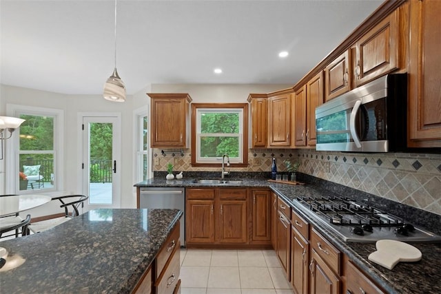 105 Averys Way, Cranberry Twp, PA 16066 - kitchen with stainless steel appliances, brown cabinets, backsplash, and recessed lighting