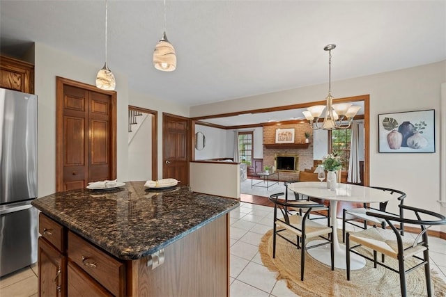 105 Averys Way, Cranberry Twp, PA 16066 - kitchen with freestanding refrigerator, light tile patterned floors, hanging light fixtures, and a chandelier