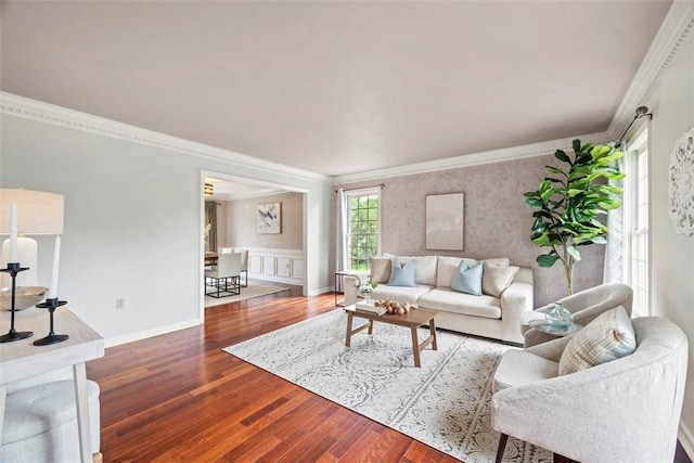 105 Averys Way, Cranberry Twp, PA 16066 - living area with wood finished floors, crown molding, wallpapered walls, and a wainscoted wall