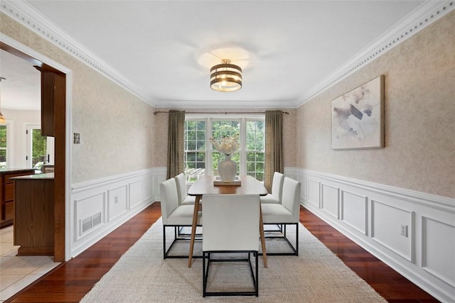 105 Averys Way, Cranberry Twp, PA 16066 - dining space featuring dark wood-style floors, a wainscoted wall, a decorative wall, and ornamental molding
