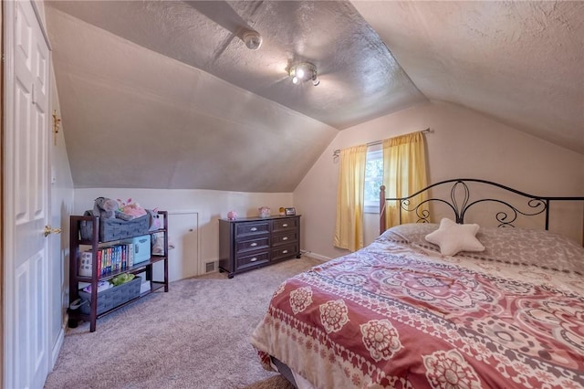 628 Illini, Monroeville, PA 15146 - bedroom with vaulted ceiling, light colored carpet, and a textured ceiling