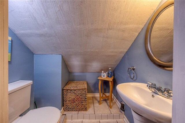 628 Illini, Monroeville, PA 15146 - bathroom featuring vaulted ceiling and tile patterned flooring