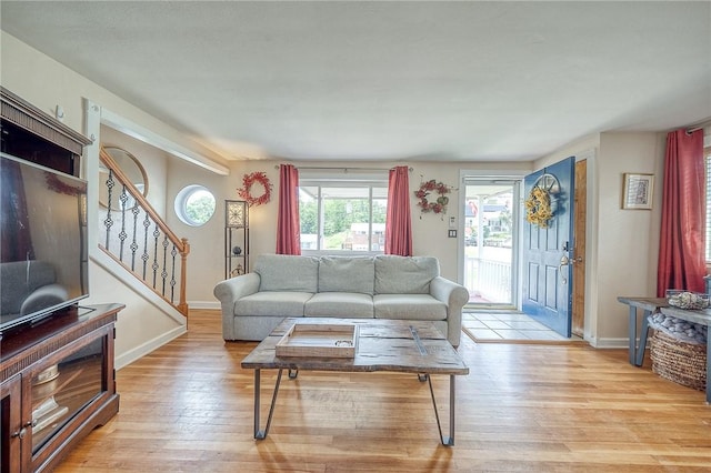 628 Illini, Monroeville, PA 15146 - living room featuring stairs and light wood-type flooring