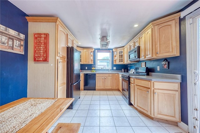 628 Illini, Monroeville, PA 15146 - kitchen with black appliances, light brown cabinetry, light countertops, glass insert cabinets, and light tile patterned flooring