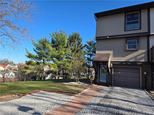 301 Holland Ct, Findlay Twp, PA 15108 - view of front of house with a garage, brick siding, a front yard, and gravel driveway