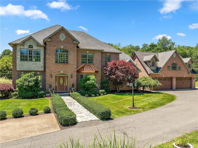 548 Lang Rd, Sewickley Heights, PA 15143 - view of front of property featuring a front lawn, brick siding, and driveway