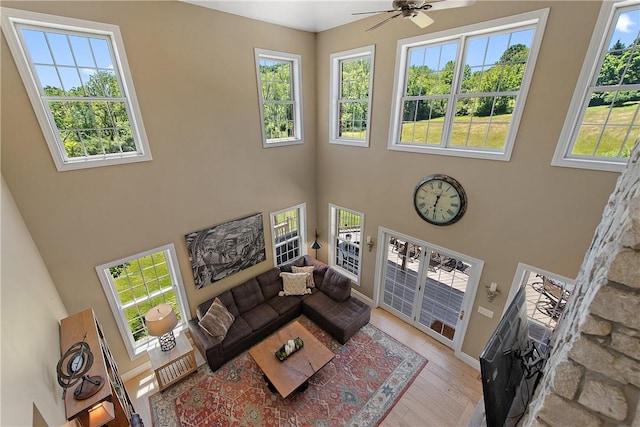 548 Lang Rd, Sewickley Heights, PA 15143 - living room featuring a towering ceiling, ceiling fan, and wood finished floors