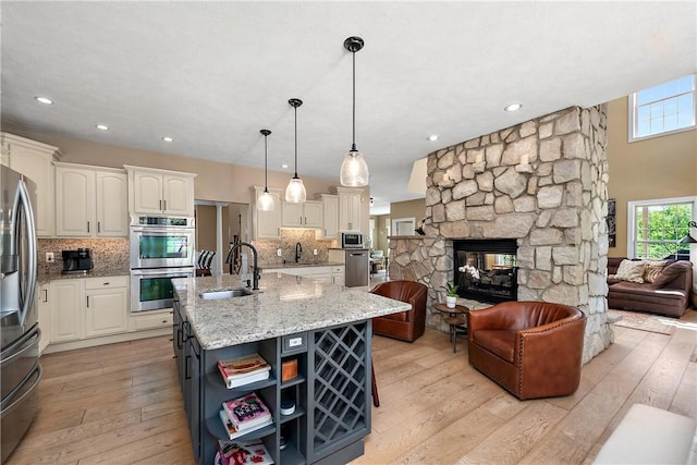 548 Lang Rd, Sewickley Heights, PA 15143 - kitchen featuring stainless steel appliances, open floor plan, open shelves, light wood-style flooring, and recessed lighting