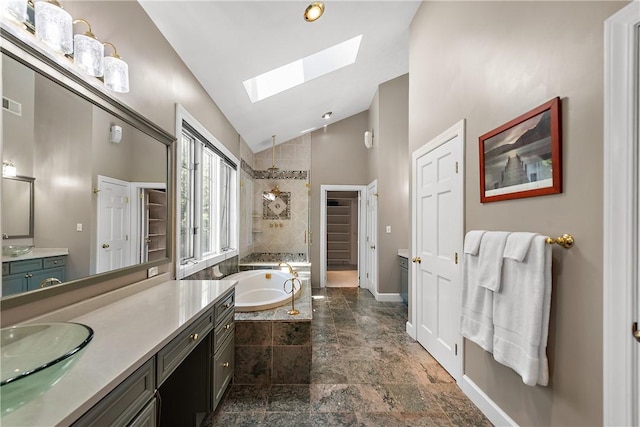 548 Lang Rd, Sewickley Heights, PA 15143 - bathroom with a skylight, vaulted ceiling, vanity, a bath, and tiled shower