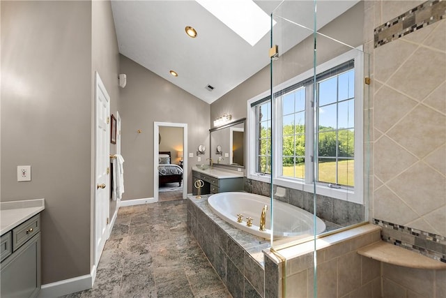 548 Lang Rd, Sewickley Heights, PA 15143 - full bathroom with vanity, connected bathroom, a garden tub, high vaulted ceiling, and stone finish flooring