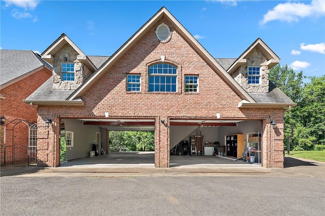 548 Lang Rd, Sewickley Heights, PA 15143 - traditional-style house featuring a garage, brick siding, and a shingled roof