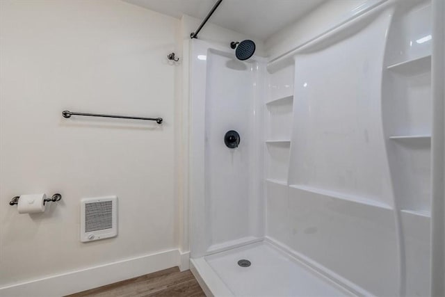 5241 Gardenville, Bethel Park, PA 15236 - bathroom with heating unit, a shower, and wood finished floors