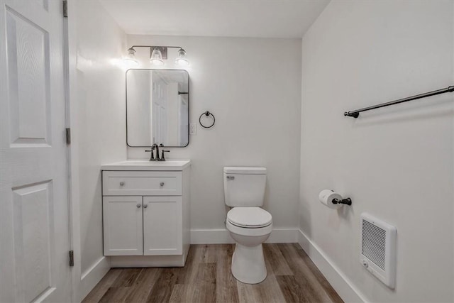5241 Gardenville, Bethel Park, PA 15236 - bathroom with wood finished floors, heating unit, and vanity