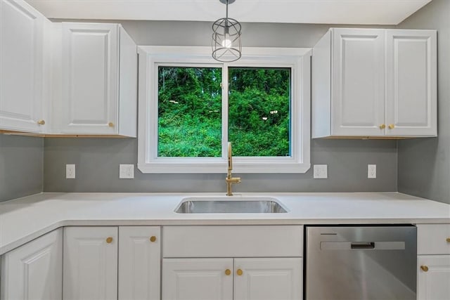 5241 Gardenville, Bethel Park, PA 15236 - kitchen with stainless steel dishwasher, white cabinets, light countertops, and hanging light fixtures