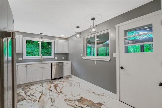 5241 Gardenville, Bethel Park, PA 15236 - kitchen featuring stainless steel appliances, white cabinetry, light countertops, light marble finish flooring, and hanging light fixtures