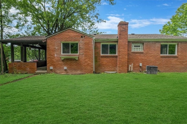 5241 Gardenville, Bethel Park, PA 15236 - back of house with a chimney, a lawn, and brick siding