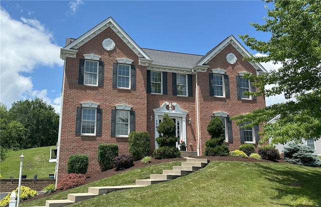 178 Foxchase Dr, North Strabane, PA 15317 - georgian-style home with a front yard and brick siding