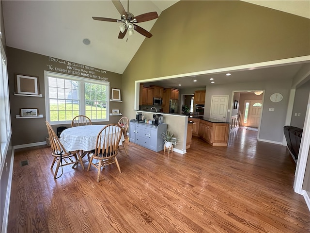 178 Foxchase Dr, North Strabane, PA 15317 - dining area with ceiling fan, high vaulted ceiling, and wood finished floors