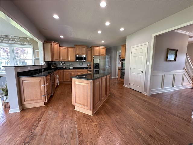178 Foxchase Dr, North Strabane, PA 15317 - kitchen with stainless steel appliances, dark wood-type flooring, recessed lighting, a center island, and a wainscoted wall