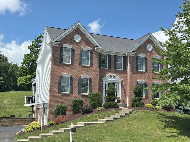 178 Foxchase Dr, North Strabane, PA 15317 - georgian-style home with brick siding, a front yard, and an attached garage