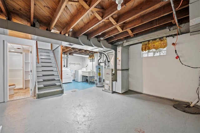 345 Franklin Dr, Peters Twp, PA 15241 - basement featuring water heater, washing machine and dryer, stairs, and heating unit