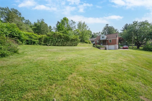 345 Franklin Dr, Peters Twp, PA 15241 - view of green lawn featuring an attached garage and driveway