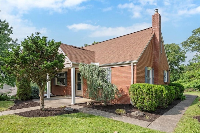 345 Franklin Dr, Peters Twp, PA 15241 - view of front of house featuring brick siding, a chimney, and a patio area
