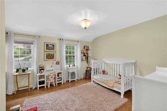 130 Kent Dr, Upper St Clair, PA 15241 - bedroom with multiple windows, wood finished floors, and a crib