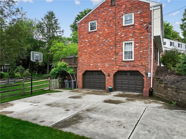 130 Kent Dr, Upper St Clair, PA 15241 - view of property exterior featuring concrete driveway, an attached garage, and brick siding