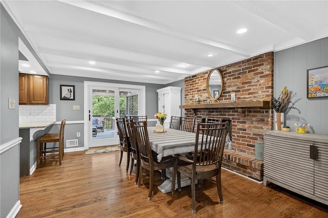 130 Kent Dr, Upper St Clair, PA 15241 - dining room with light wood-style flooring, beam ceiling, french doors, and a fireplace