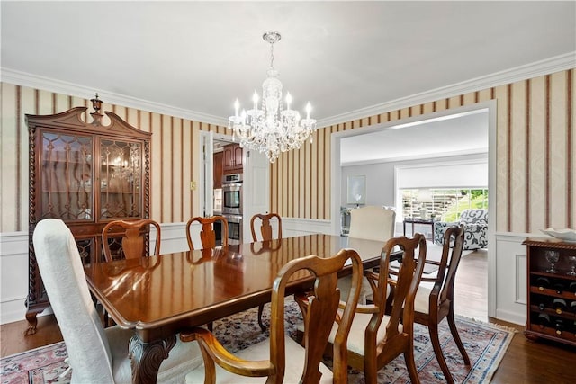 1061 Apple Hill Ln, Mccandless, PA 15101 - dining room featuring wallpapered walls, a chandelier, crown molding, wainscoting, and wood finished floors
