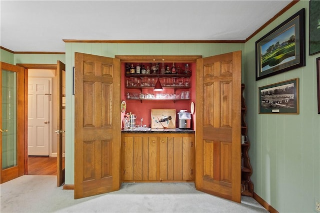 1061 Apple Hill Ln, Mccandless, PA 15101 - indoor wet bar with ornamental molding, wood walls, and carpet flooring
