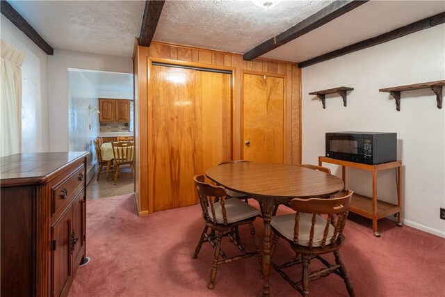2509 Spring St, Arlington, PA 15210 - dining area with beam ceiling, carpet floors, and a textured ceiling
