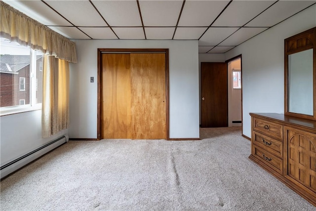 2509 Spring St, Arlington, PA 15210 - carpeted bedroom with a paneled ceiling, a closet, and a baseboard heating unit