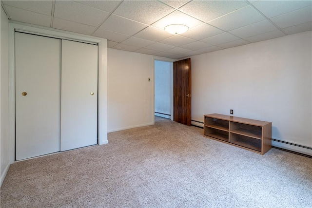 2509 Spring St, Arlington, PA 15210 - unfurnished bedroom with carpet floors, a paneled ceiling, a closet, baseboard heating, and a baseboard radiator